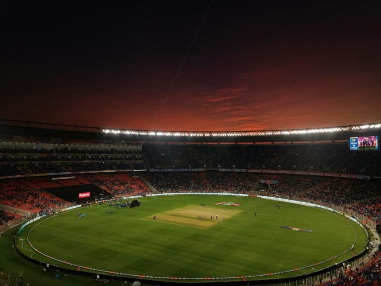 Cricket stadium with a green pitch