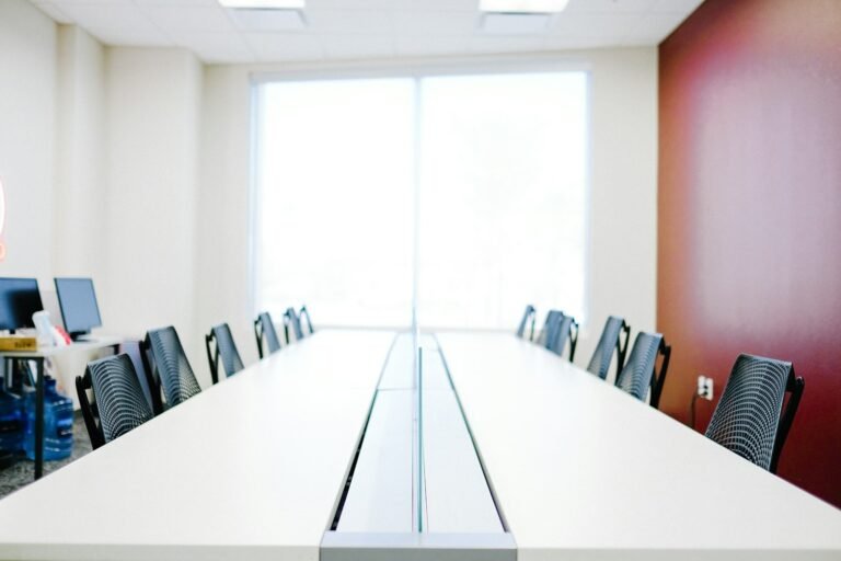 Empty modern office with a long table and chairs