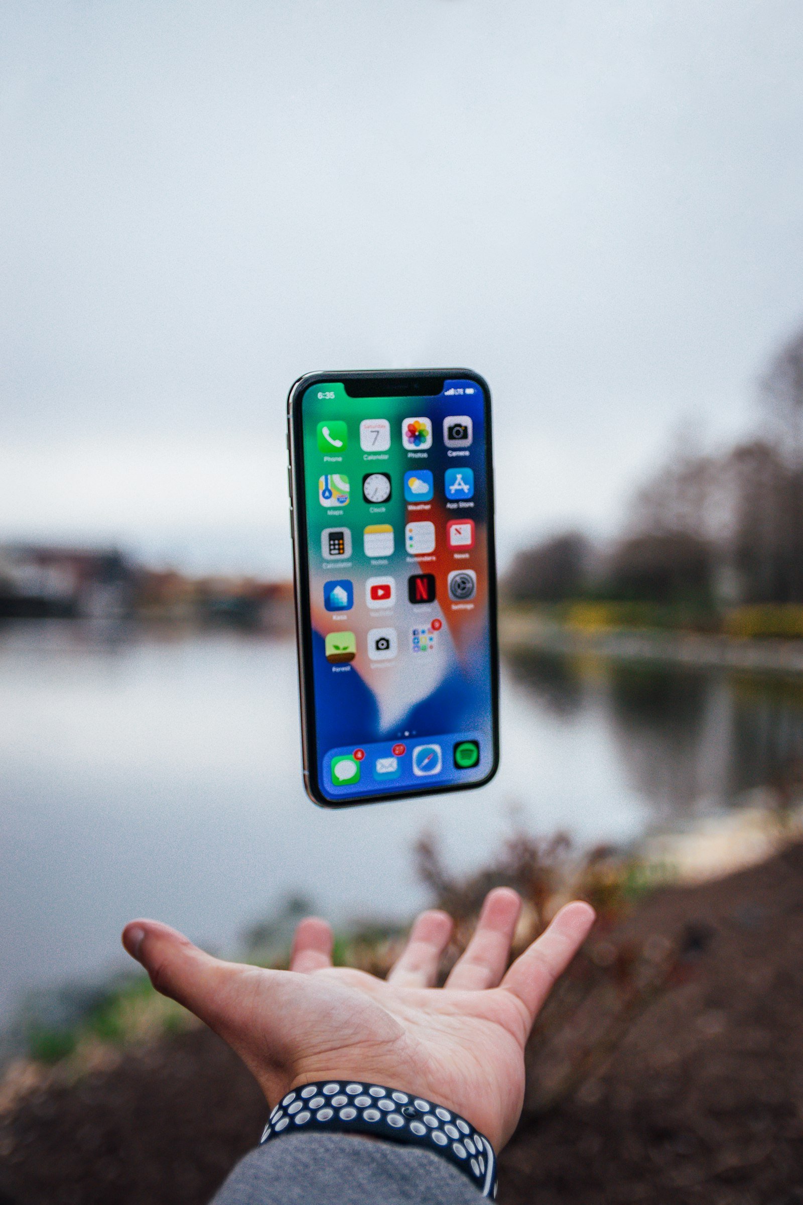Smartphone floating above an open palm